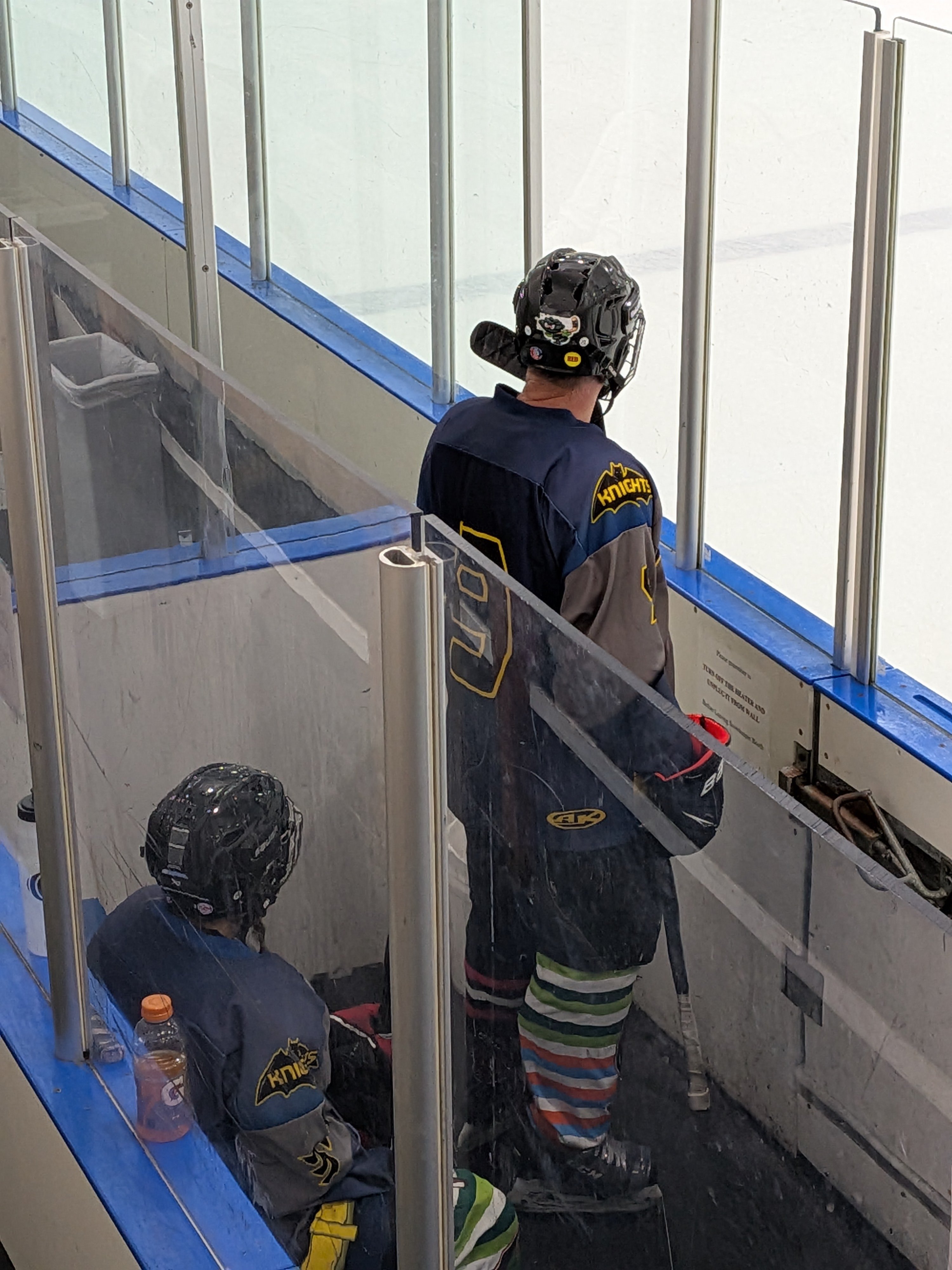 Dawne Griffith and Scott Griffith sitting together in the penalty box